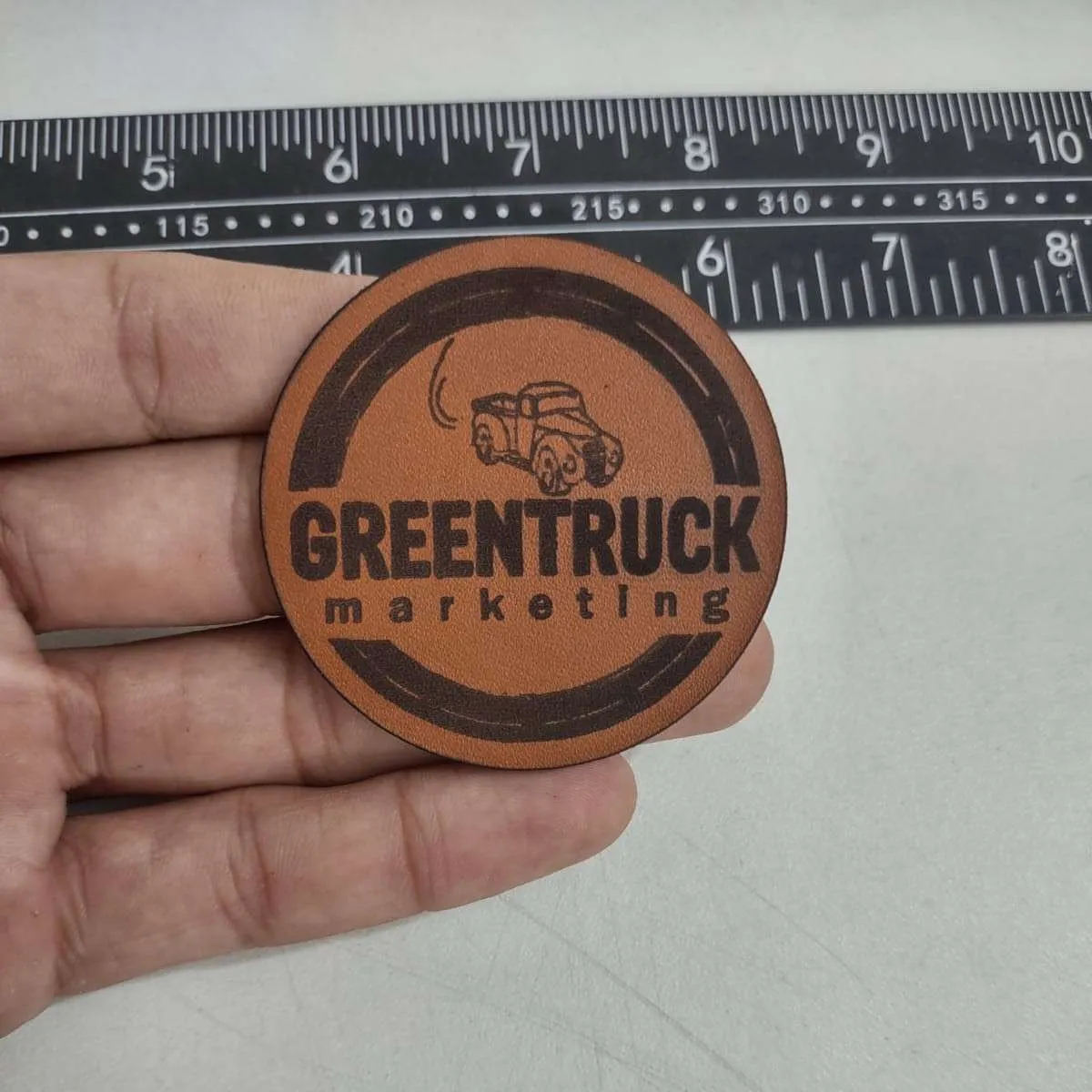 Premium leather patch with embossed logo design - Example 4 by Dynamic Digitizers USA