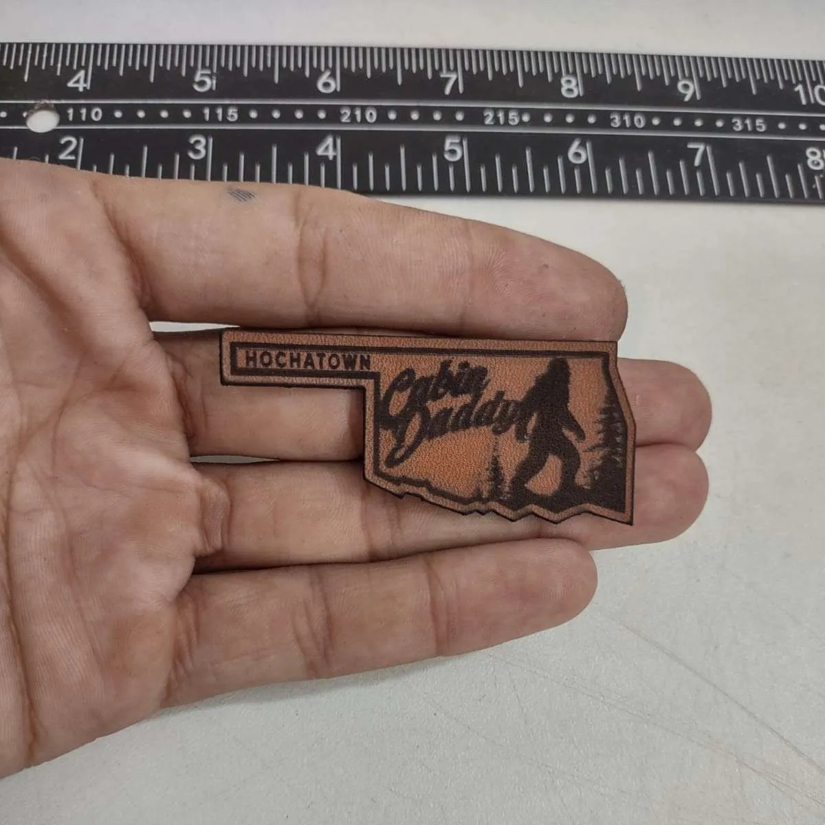 Premium leather patch with embossed logo design - Example 6 by Dynamic Digitizers USA