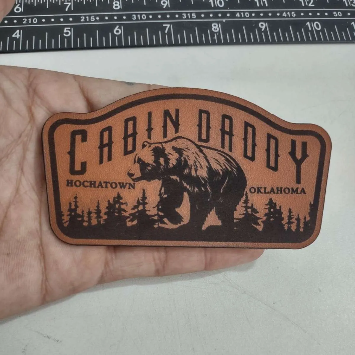 Premium leather patch with embossed logo design - Example 8 by Dynamic Digitizers USA